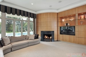 Living room with rounded fireplace