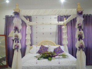 beautiful-bridal-bedroom-decor-with-white-bedding-and-purple-curtain-bridal-bedroom-decoration-920x690
